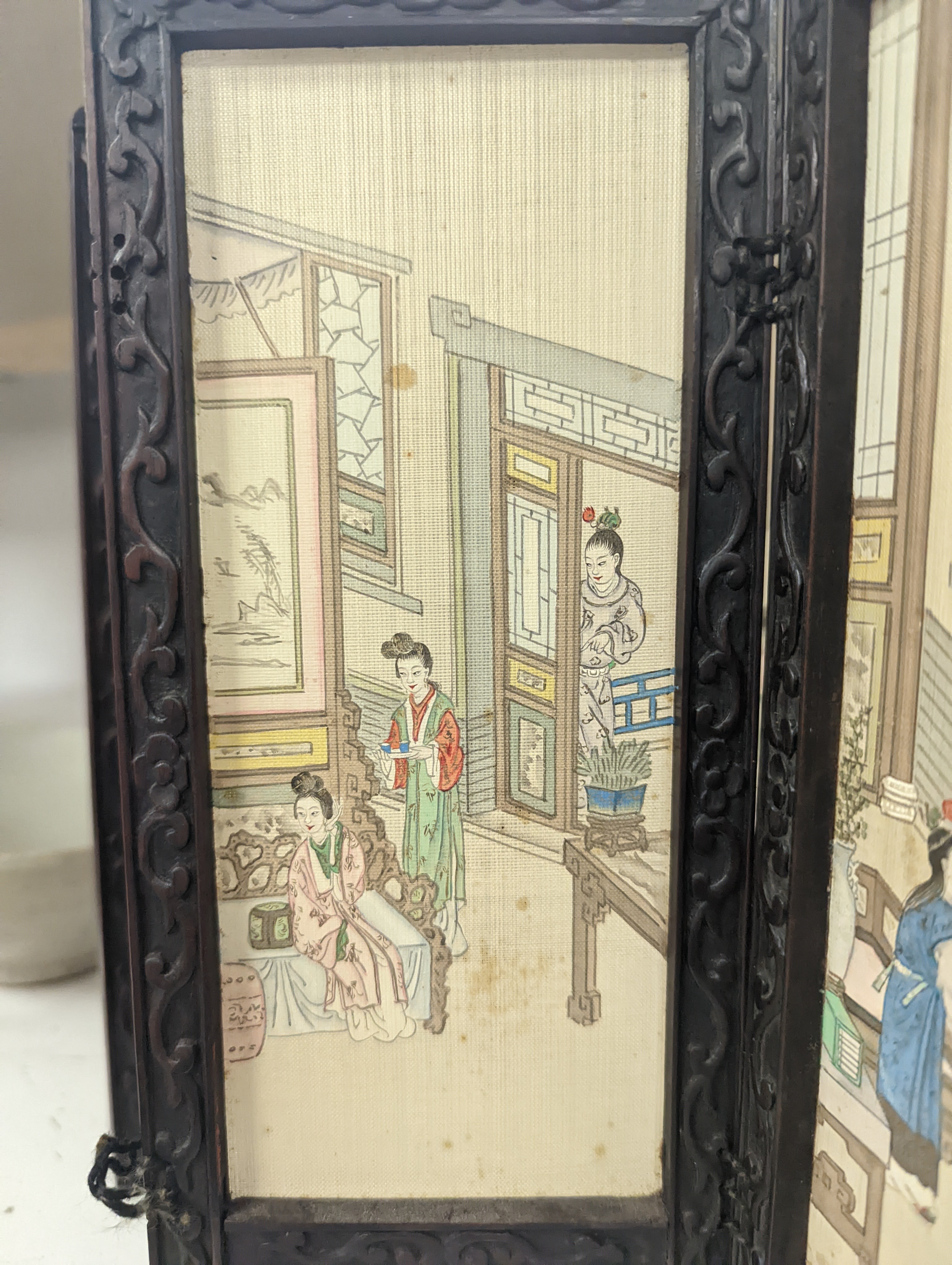 A Chinese hardwood framed painted silk four fold miniature screen, inset with painted silk panels, 28cm